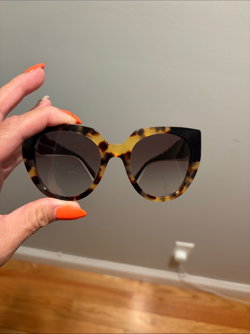 Prada Tortoiseshell Cat Eye Sunglasses with Black Accents
